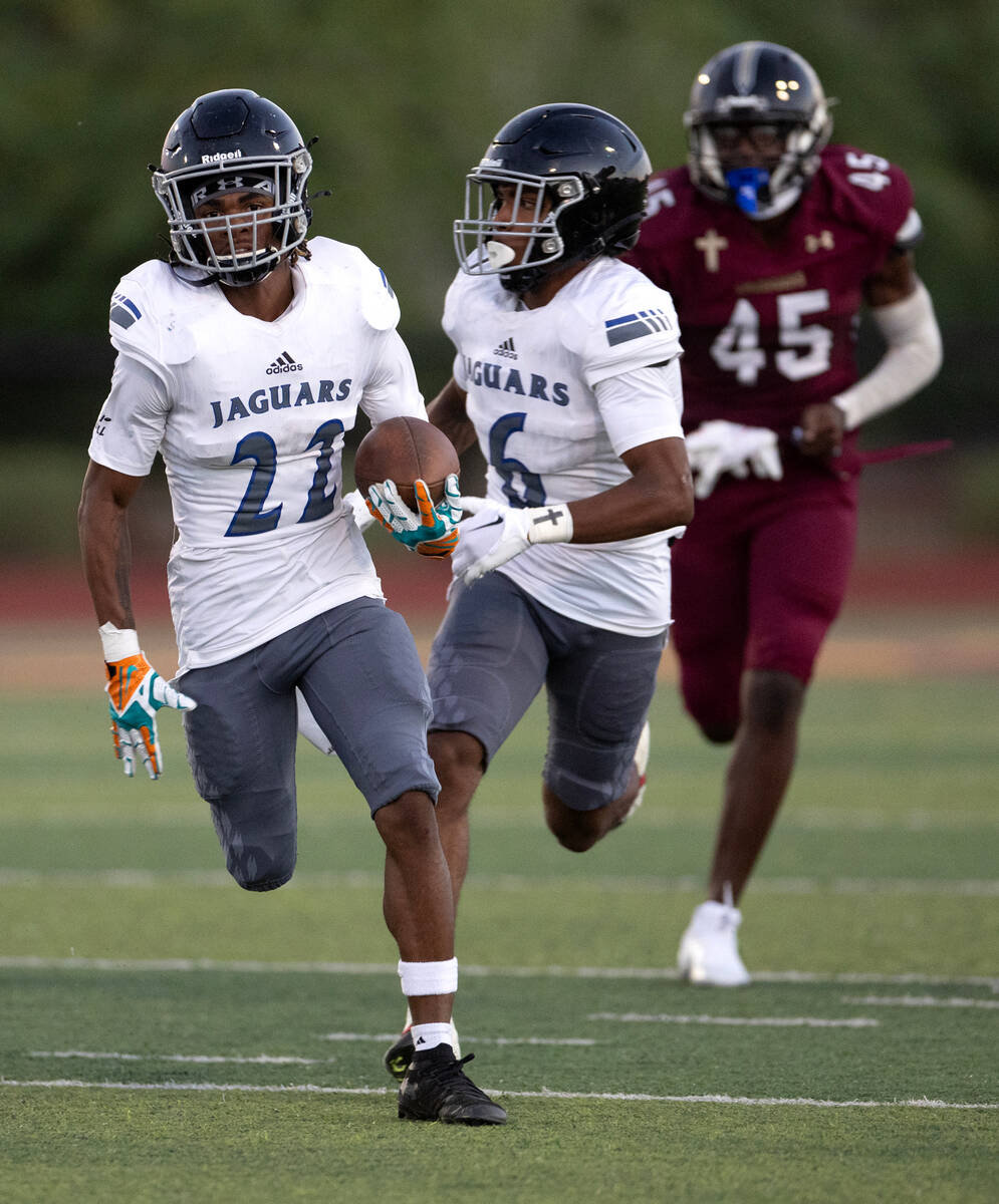 Desert Pines wide receiver Trey Jackson (22) breaks away with the ball before reaching the end ...