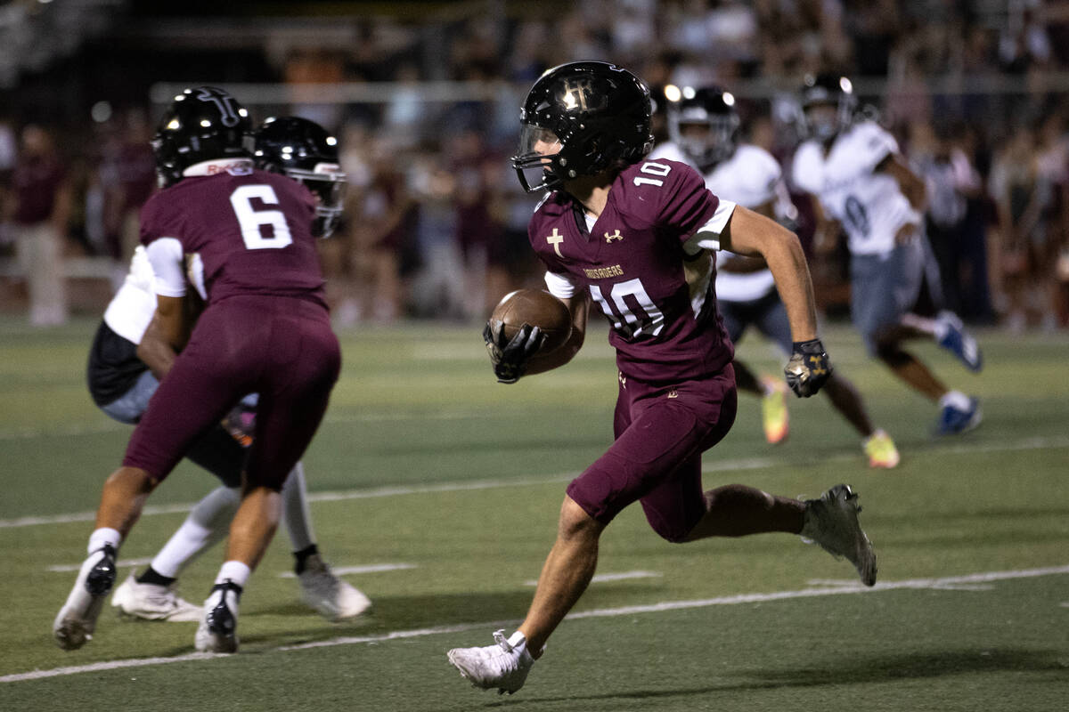 Faith Lutheran quarterback Graham Radke (10) runs the ball during the second half of a high sch ...