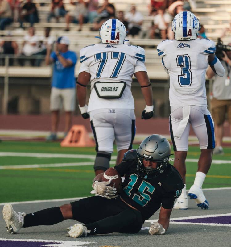 Silverado running back Kaina Crisostomo (15) catches his breath after being tackled for a safet ...