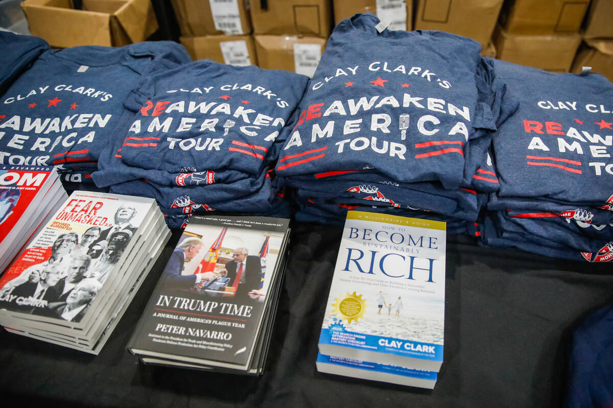 Merchandise for the ReAwaken America Tour, as seen on Friday, Aug. 25, 2023, at Craig Ranch Reg ...