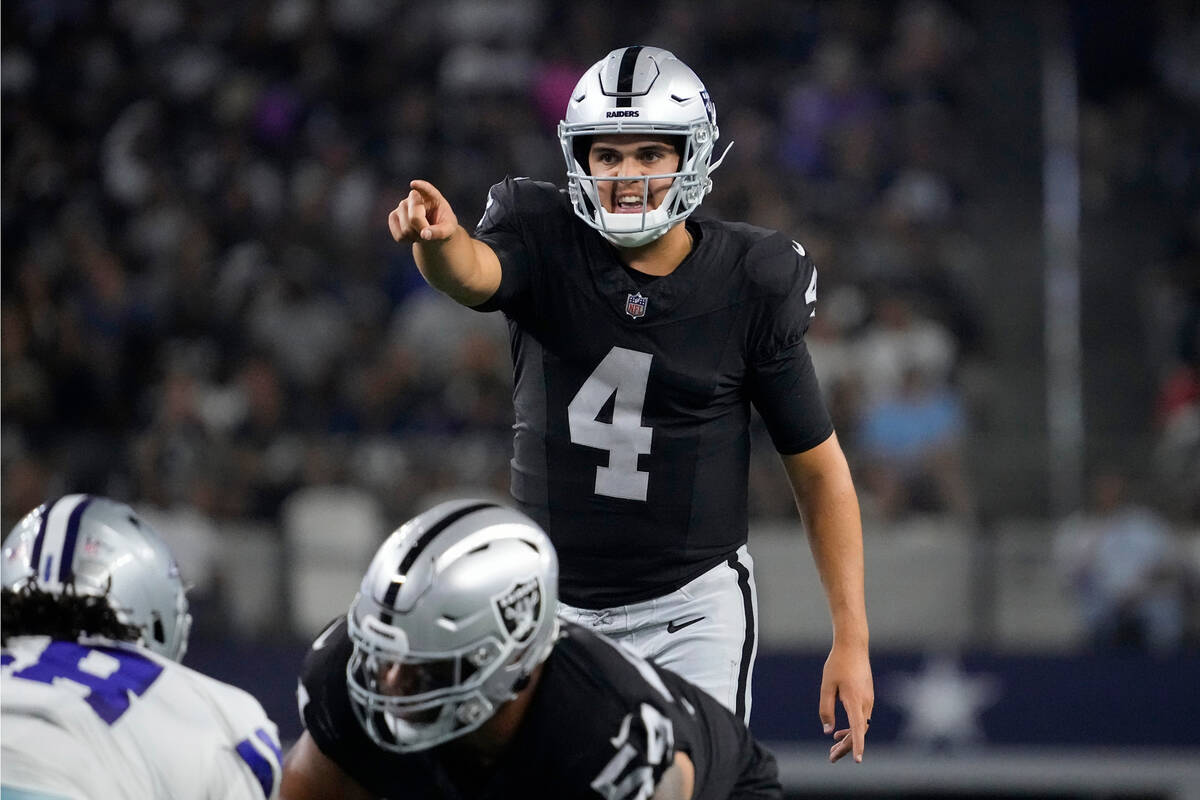 Las Vegas Raiders quarterback Aidan O'Connell signals at the line of scrimmage in the first hal ...