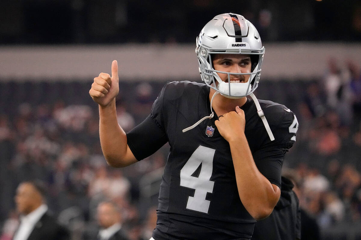 Las Vegas Raiders quarterback Aidan O'Connell (4) gestures as he warms up before the first half ...