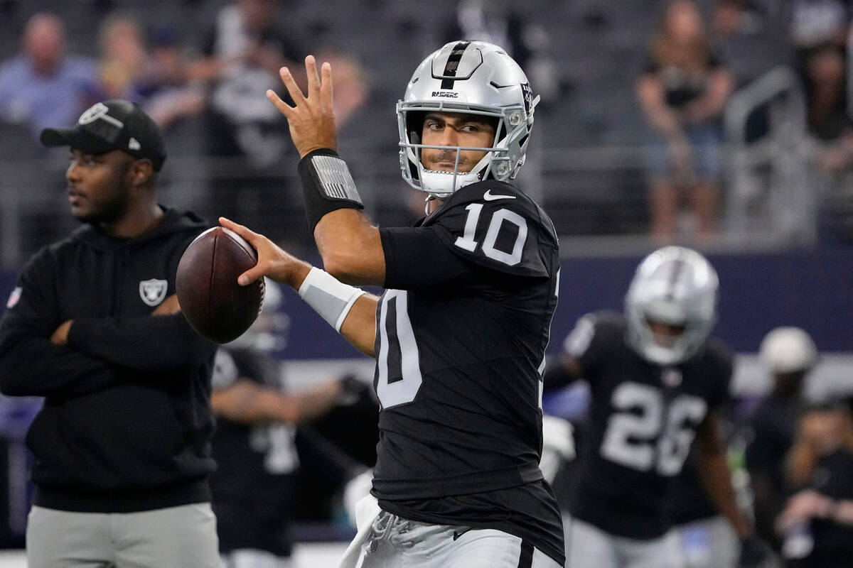 Las Vegas Raiders quarterback Aidan O'Connell (4) gestures as he warms up  before the first half of a preseason NFL football game against the Dallas  Cowboys in Arlington, Texas, Saturday, Aug. 26