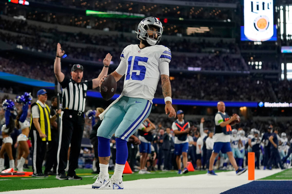 Dallas Cowboys quarterback Will Grier runs the ball into the end zone for a touchdown in the fi ...