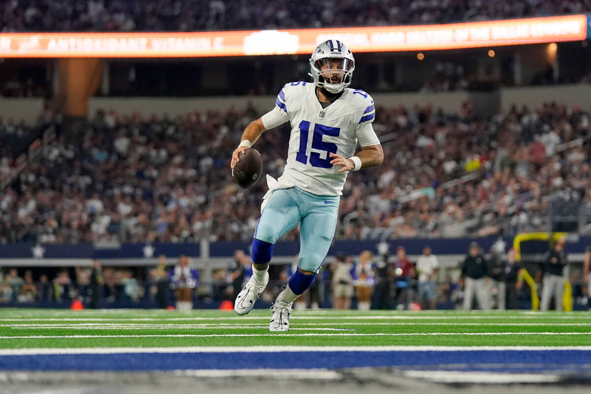 Dallas Cowboys quarterback Will Grier sprints to the end zone to score a touchdown in the first ...