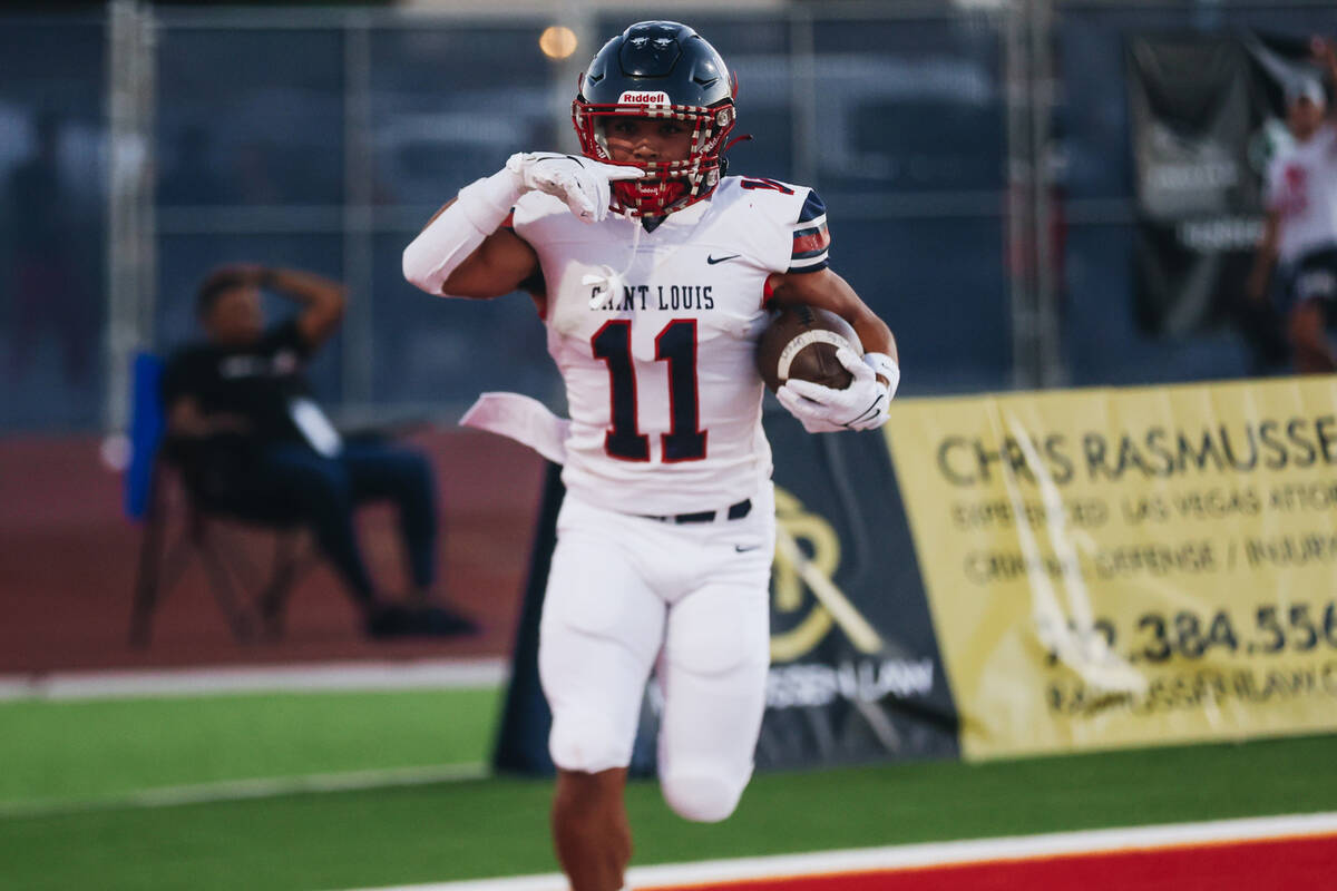 St. Louis slotback Titan Lacaden celebrates a touchdown during an Island Classic game against L ...