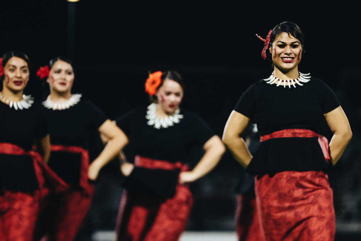 Traditional Hawaiian dancers perform during halftime of an Island Classic game between Liberty ...