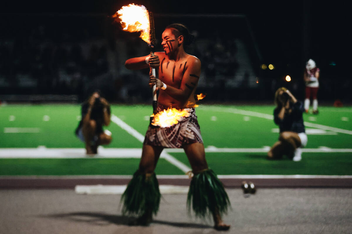 Liberty defensive back Xzavier Smith performs a fire dance during halftime of an Island Classic ...