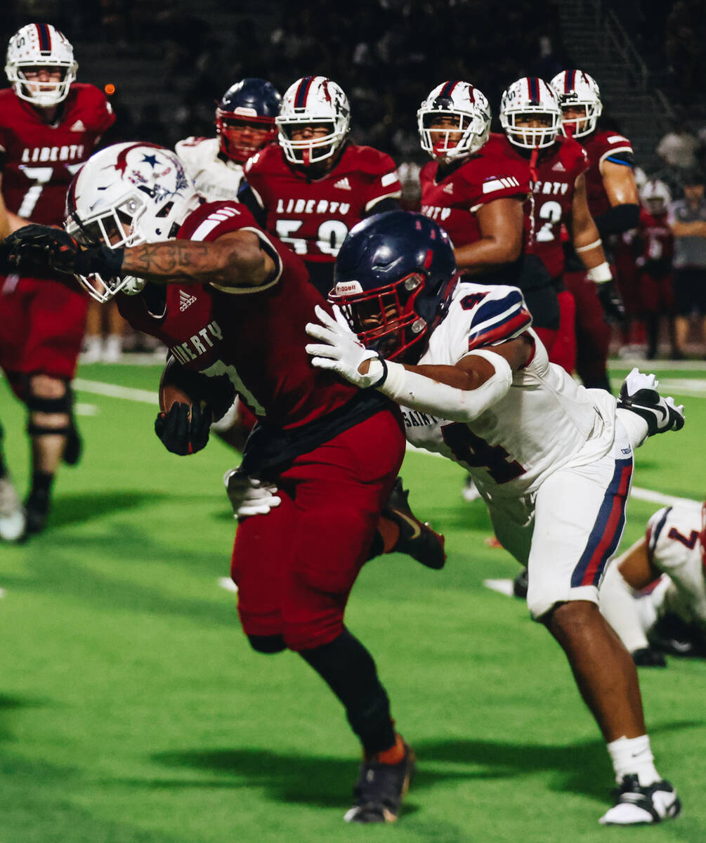 Liberty wide receiver Jayden Robertson (7) runs with the ball during an Island Classic game aga ...