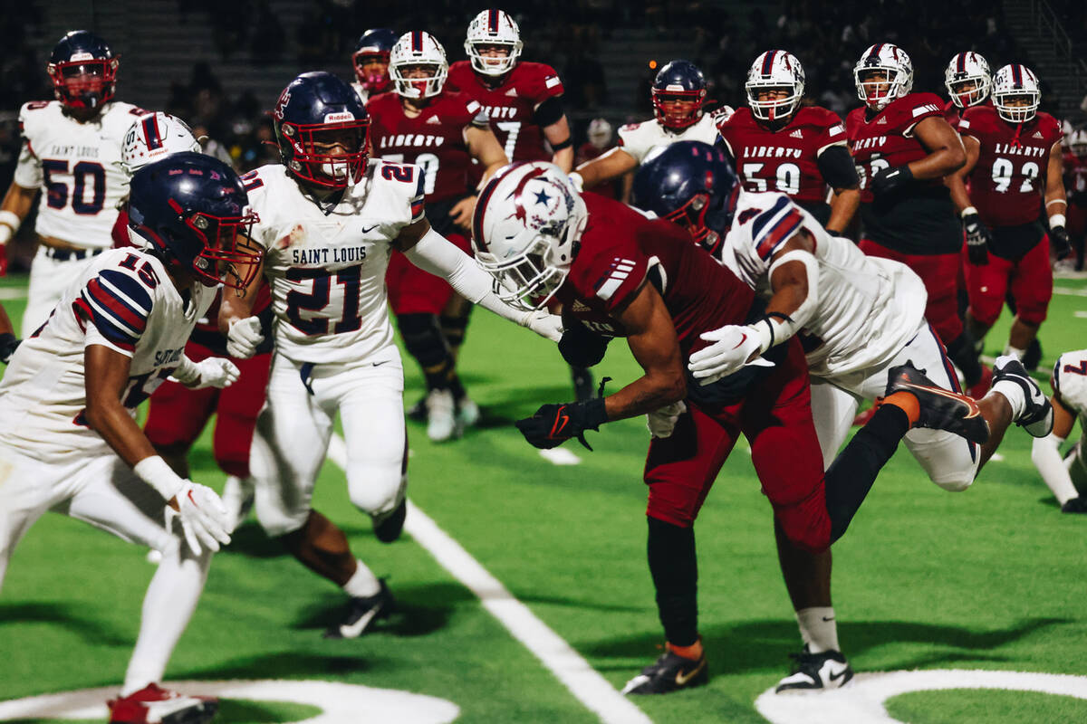 Liberty wide receiver Jayden Robertson (7) runs with the ball during an Island Classic game aga ...