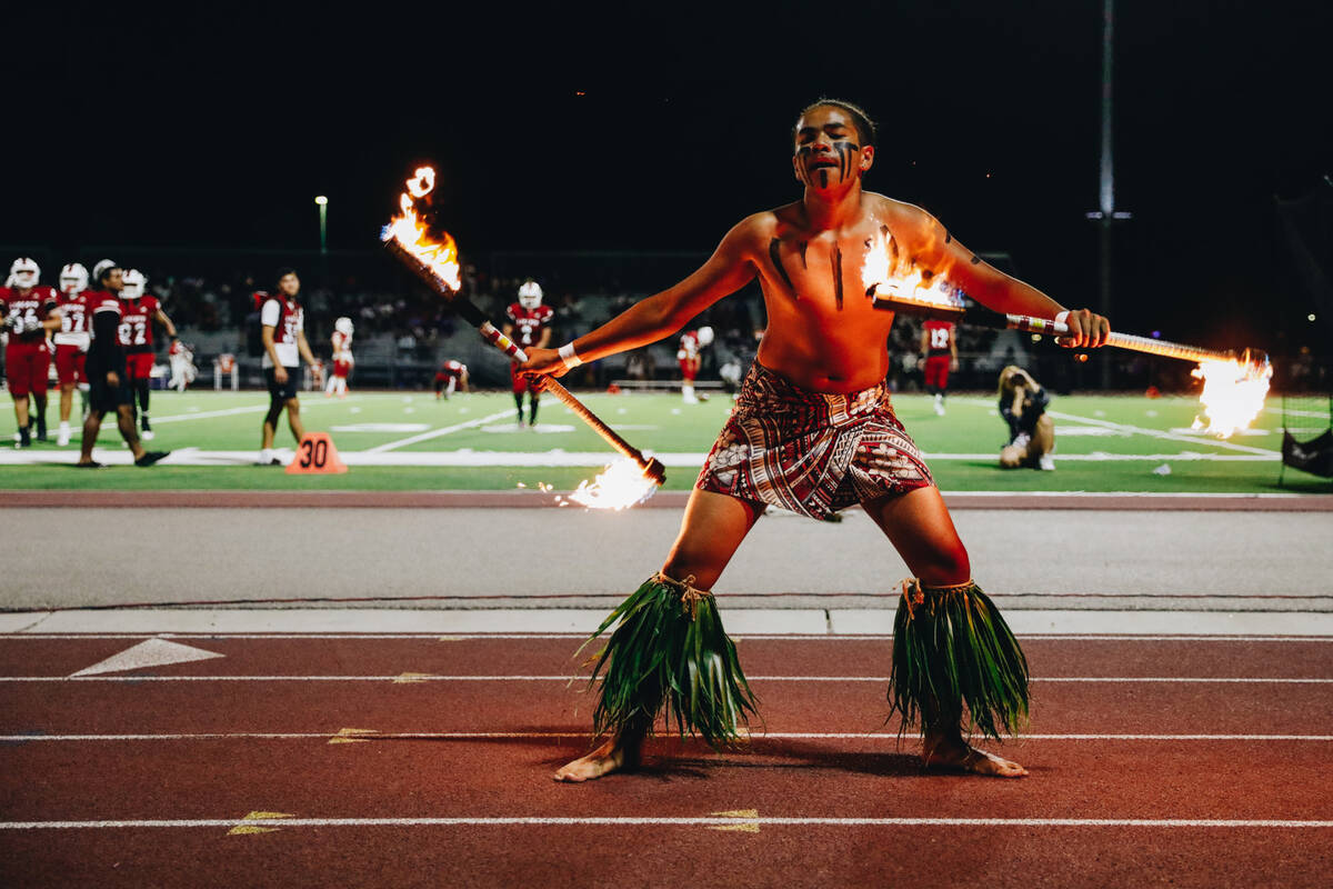 Liberty defensive back Xzavier Smith performs a fire dance during halftime of an Island Classic ...