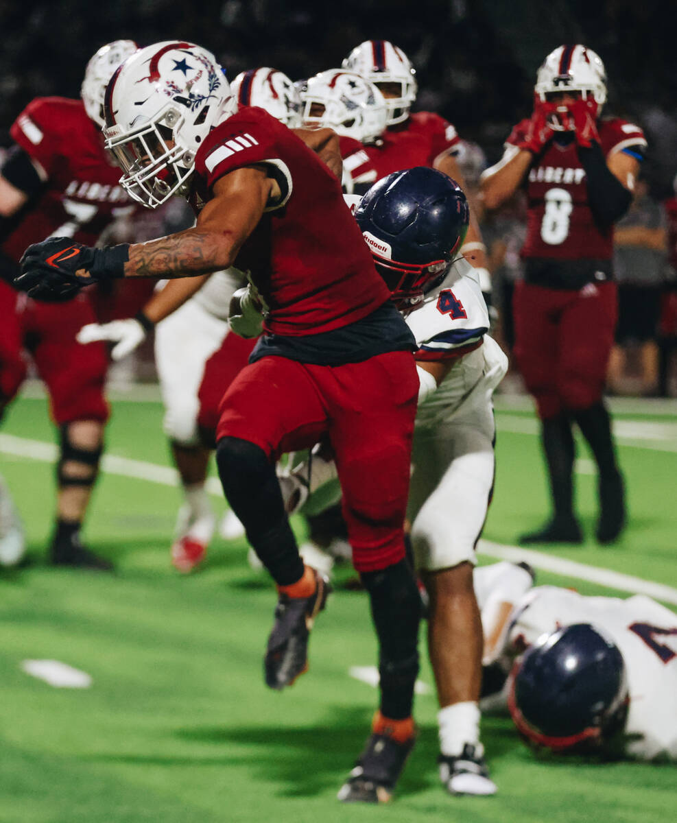 Liberty wide receiver Jayden Robertson (7) runs with the ball during an Island Classic game aga ...