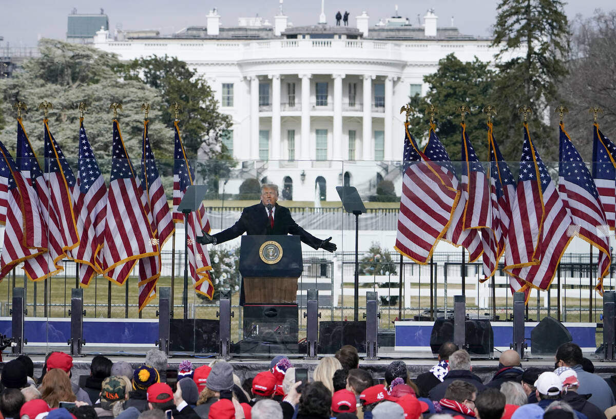 FILE - With the White House in the background, President Donald Trump speaks at a rally in Wash ...