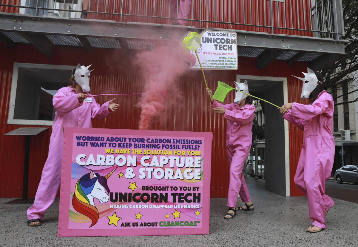 Members of Extinction Rebellion stage a protest in Cape Town, South Africa, Friday, Nov. 11, 20 ...