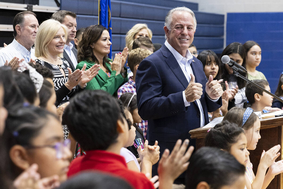 Gov Joe Lombardo flashes a thumbs-up after speaking during a school choice rally at Saint Anne ...