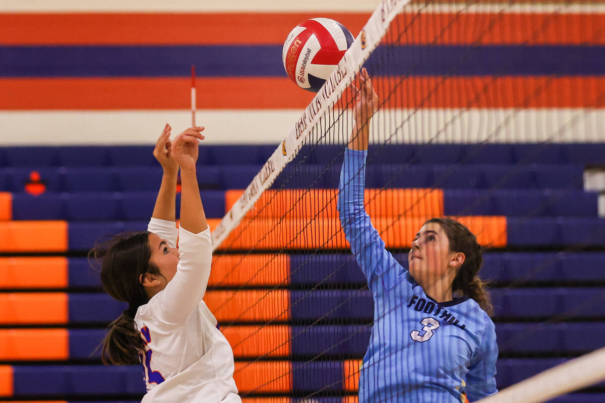 Bishop Gorman’s Alexa Ham (15) prepares to block a hit from Foothill’s Lexington ...