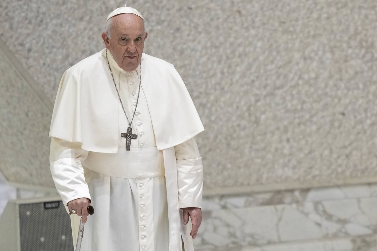 Pope Francis arrives for his weekly general audience in the Pope Paul VI hall at the Vatican, W ...