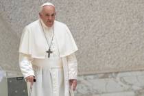 Pope Francis arrives for his weekly general audience in the Pope Paul VI hall at the Vatican, W ...