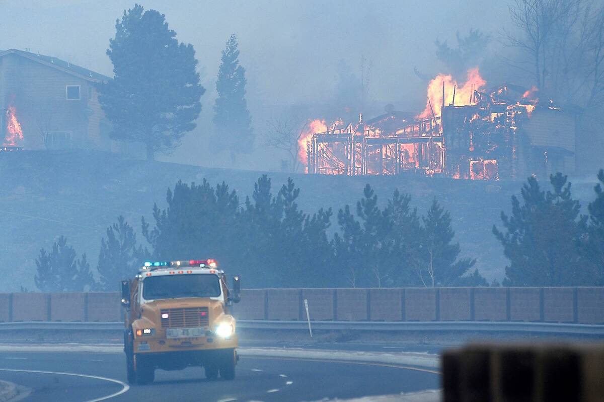Firefighters battle the Pinehaven Fire in the Caughlin Ranch area of Reno on Tuesday, Nov. 17, ...