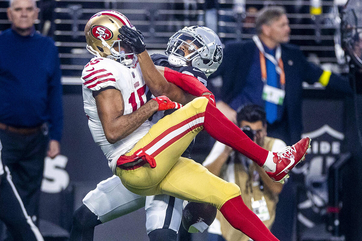 San Francisco 49ers wide receiver Jauan Jennings (15) has a pass deflected by Raiders cornerbac ...