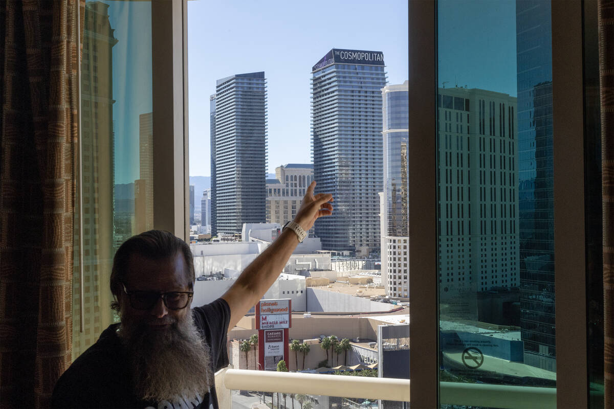Realtor Kevin Schroeder of Simply Vegas Real Estate shows the view from a penthouse suite that ...