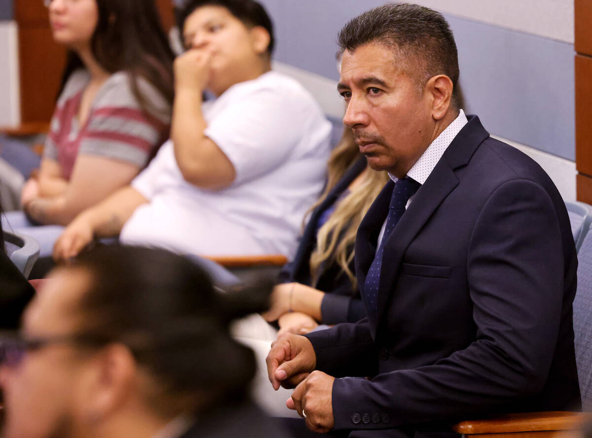 Former Alpine Motel Apartments owner Adolfo Orozco-Garcia, right, waits to appear in Clark Coun ...