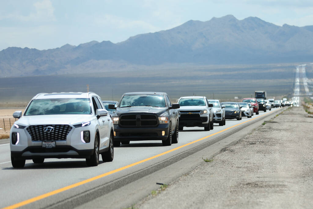 Cars traveling from California sit in traffic on Interstate 15 after passing over the state bor ...