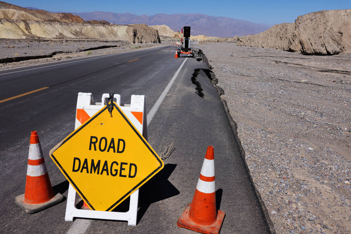 Damage on California State Route 190, a road into Death Valley National Park, is visible Thursd ...