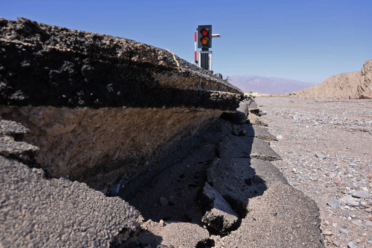 Damage on California State Route 190, a road into Death Valley National Park, is visible Thursd ...