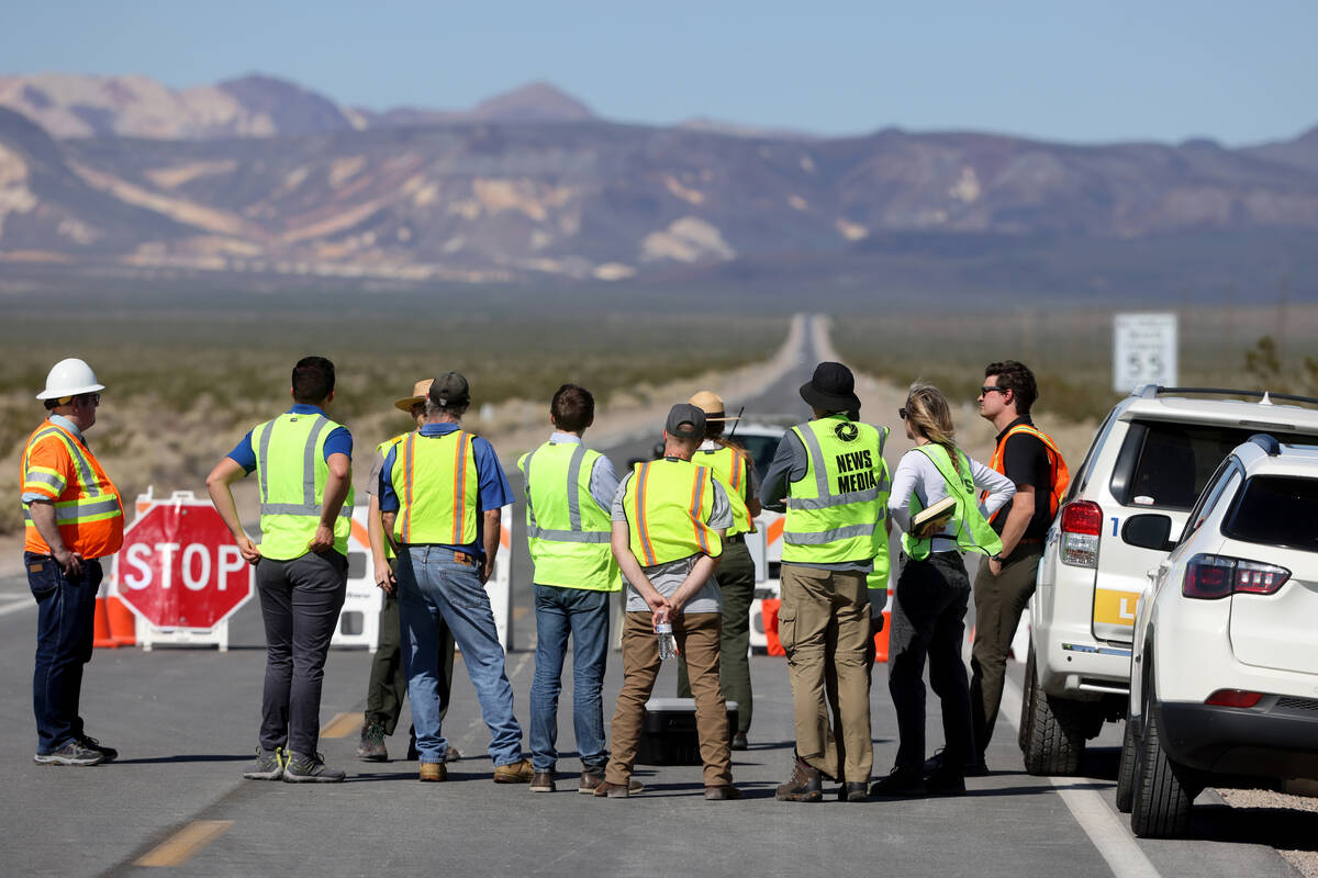 Members of the news media gather with park rangers for a tour of Hilary storm damage in Death V ...