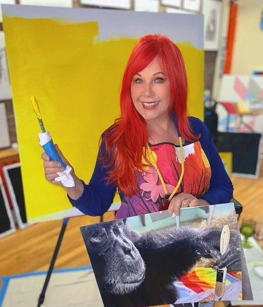 Kate Pierson of the B-52's is shown painting at the Save The Chimps sanctuary in Fort Pierce, F ...