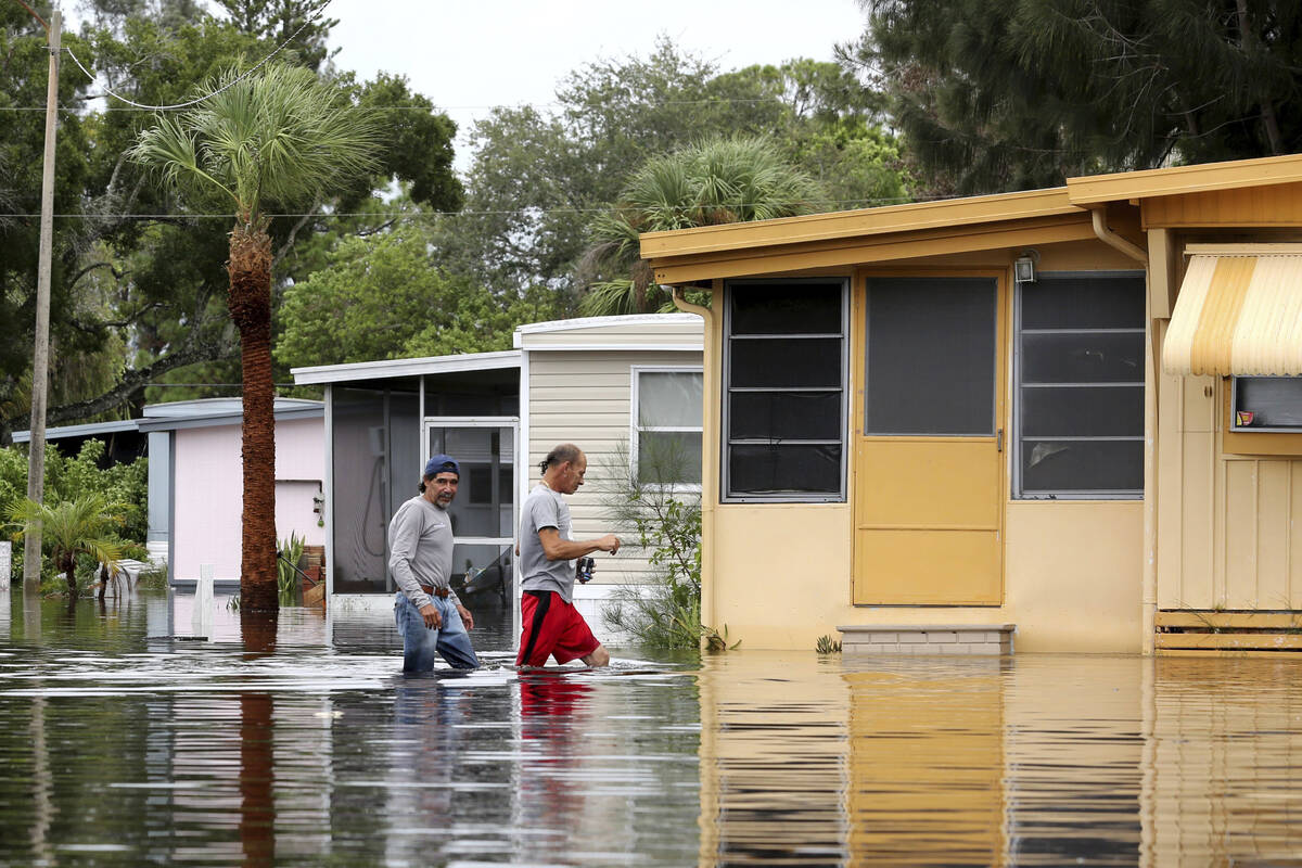 Residents of Twin City Mobile Home Park, a manufactured home community in flood zone A, navigat ...
