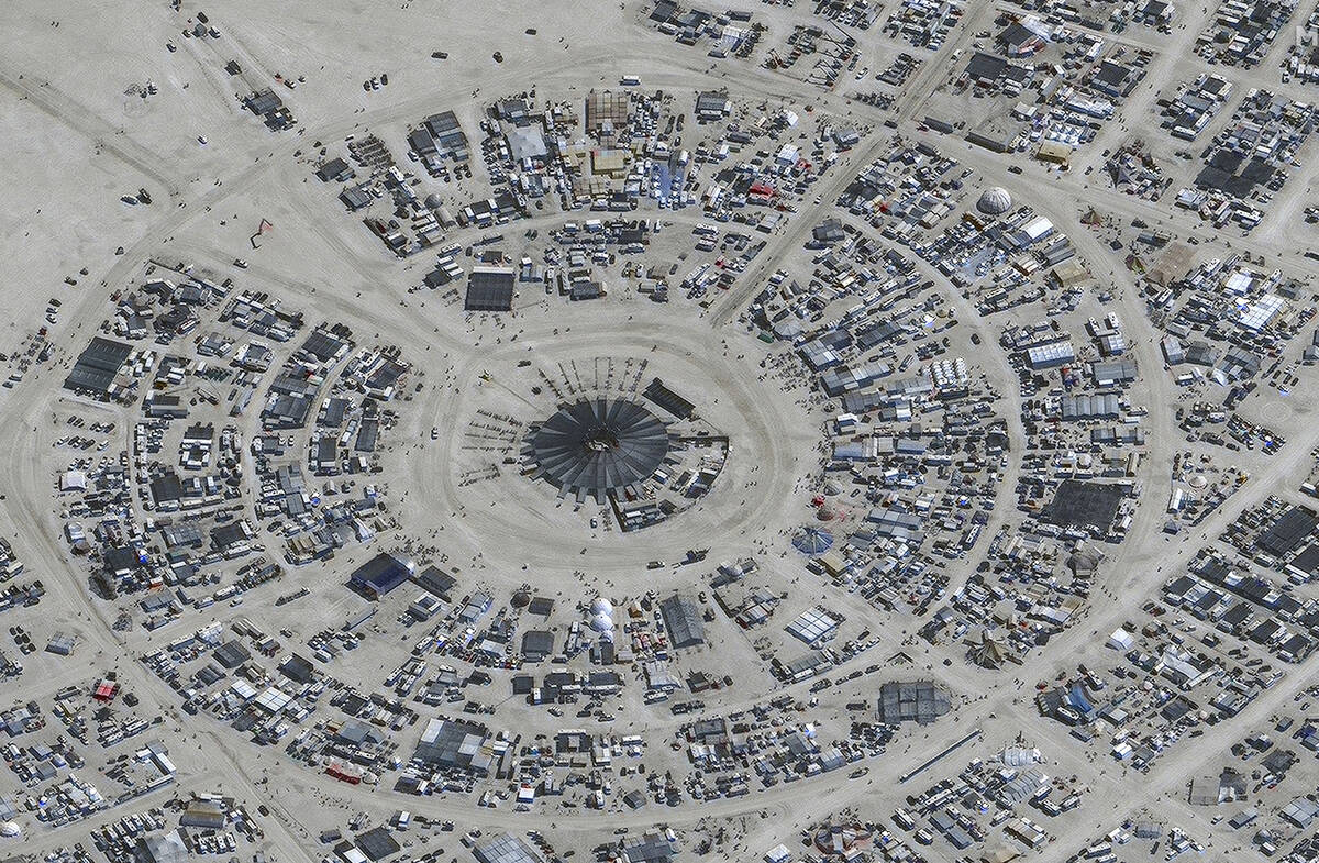 In this satellite photo provided by Maxar Technologies, an overview of Burning Man festival in ...