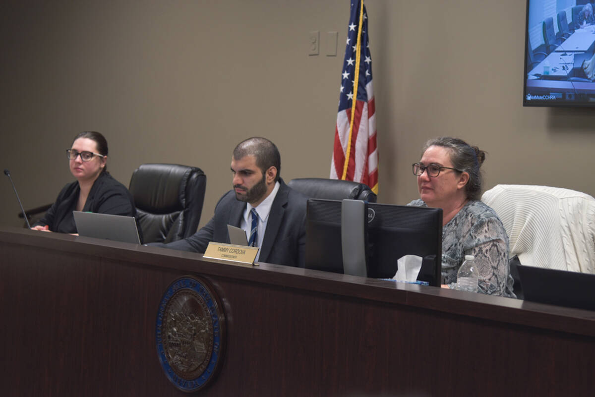 Public Utilities Commissioner Tammy Cardova, far right, and members of the PUC staff listened t ...