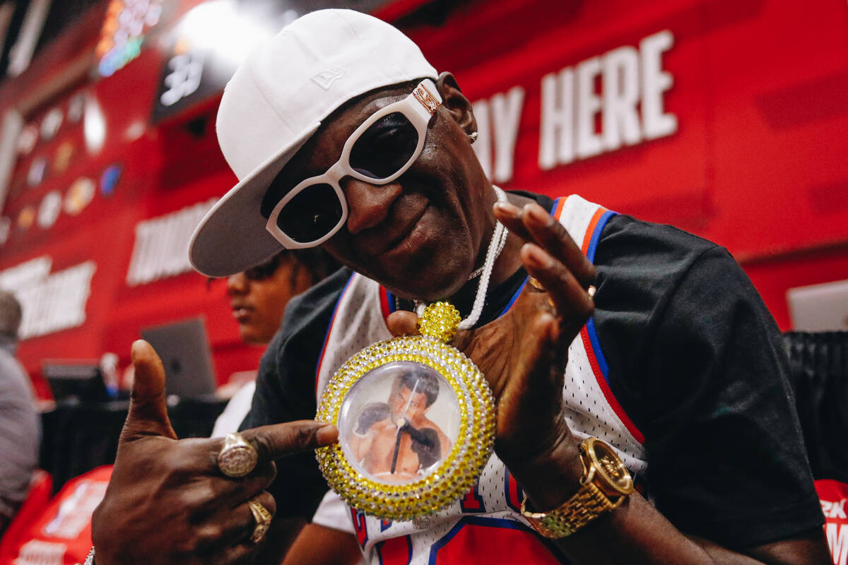 Flavor Flav shows off his jewelry during an NBA Summer League game between the Milwaukee Bucks ...