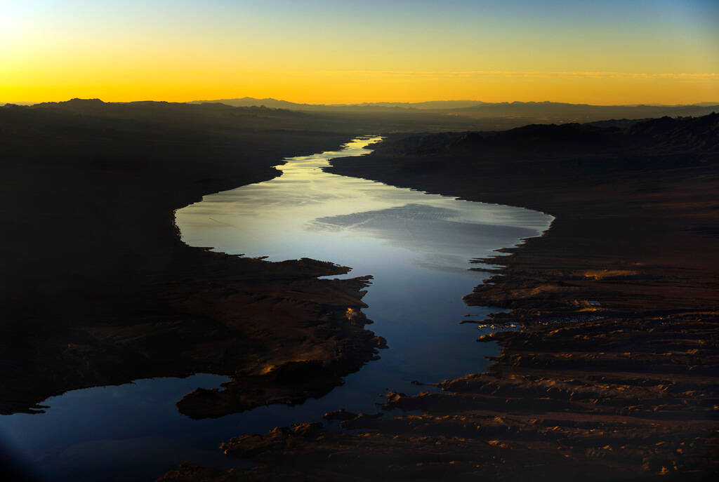 The sun is about to rise above Cottonwood Cove, bottom right, on Lake Mohave along the Colorado ...