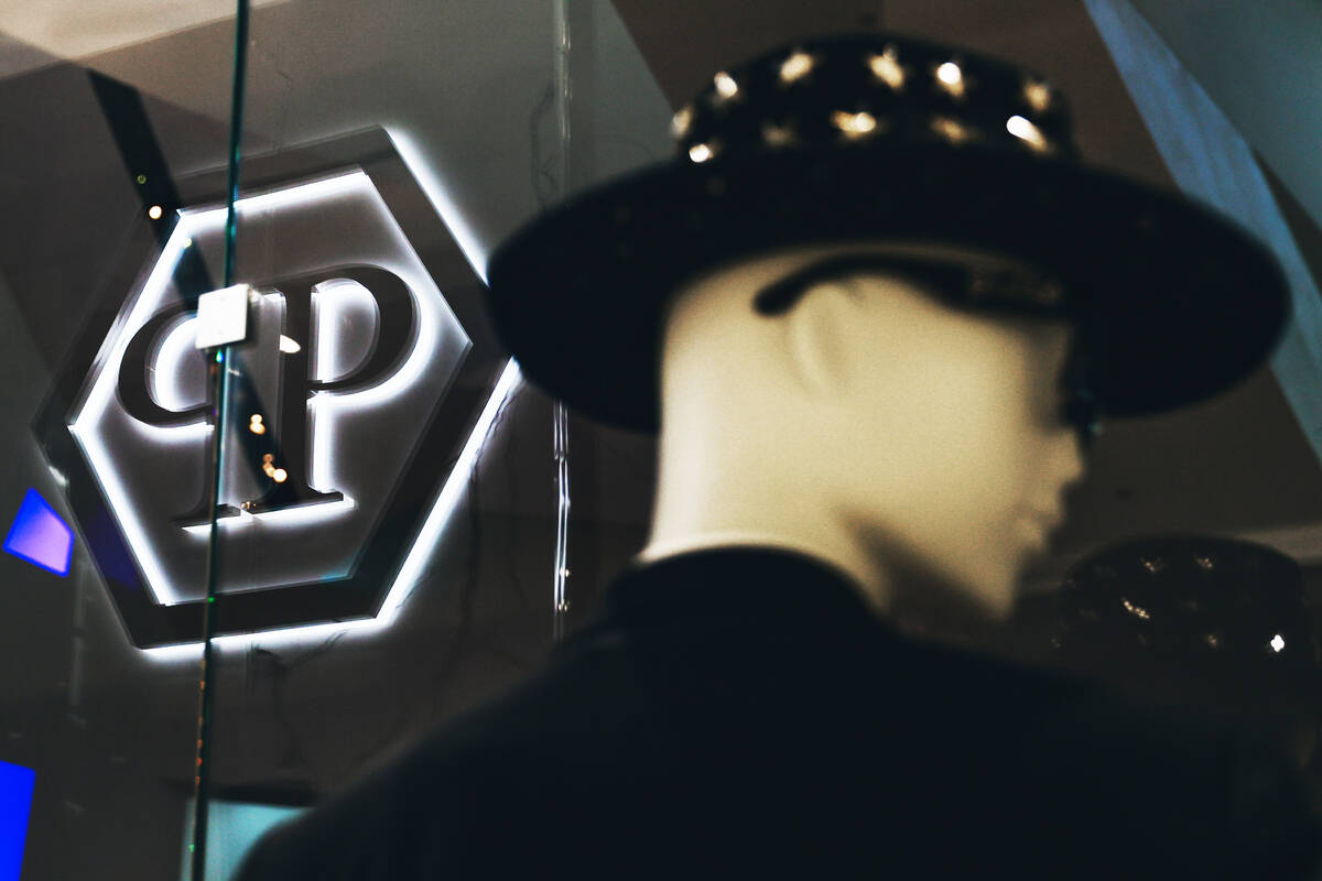 Philipp Plein’s logo is reflected in a shop window at the Philipp Plein boutique inside ...