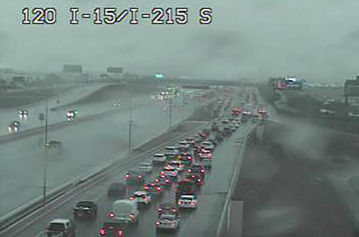 Motorists in heavy rain at Interstate 15 and the 215 Beltway about 3:10 p.m. Friday, Sept. 1, 2 ...