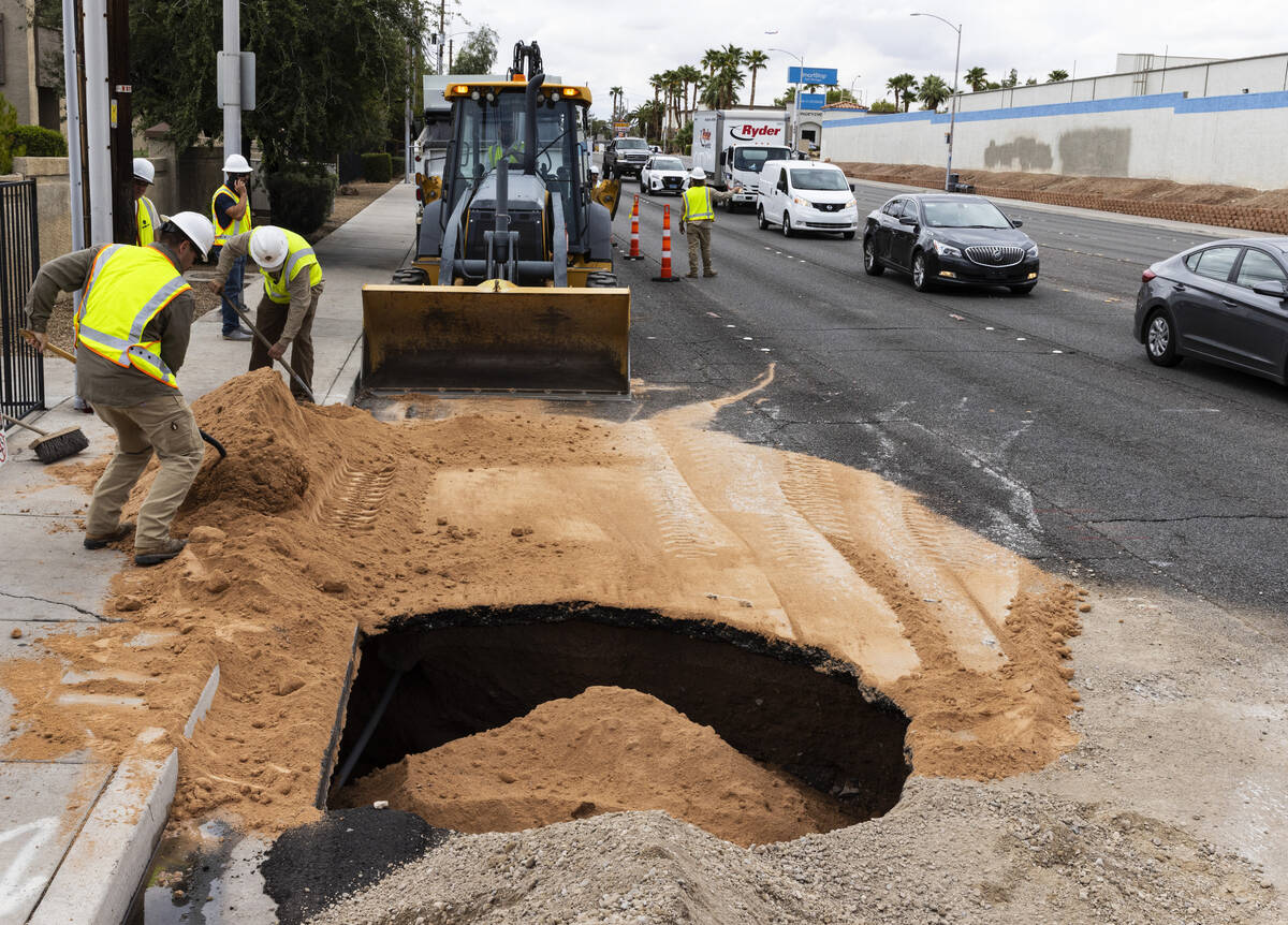 Traffic is backed up as crews continue to repair a large sinkhole near Jones Boulevard and Roch ...