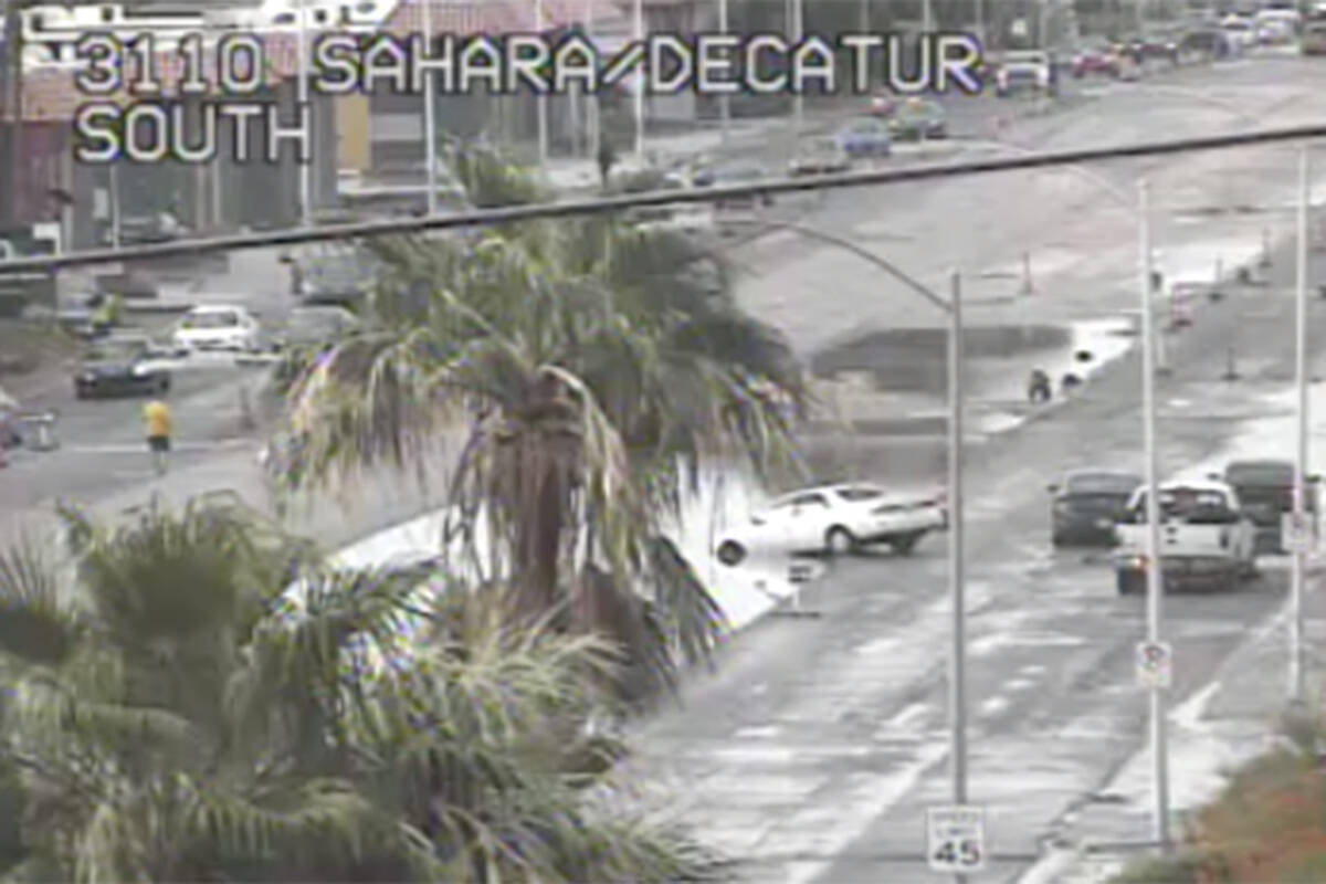 Heavy rain caused a vehicle to get stuck at the intersection of Sahara Avenue and Decatur Boule ...