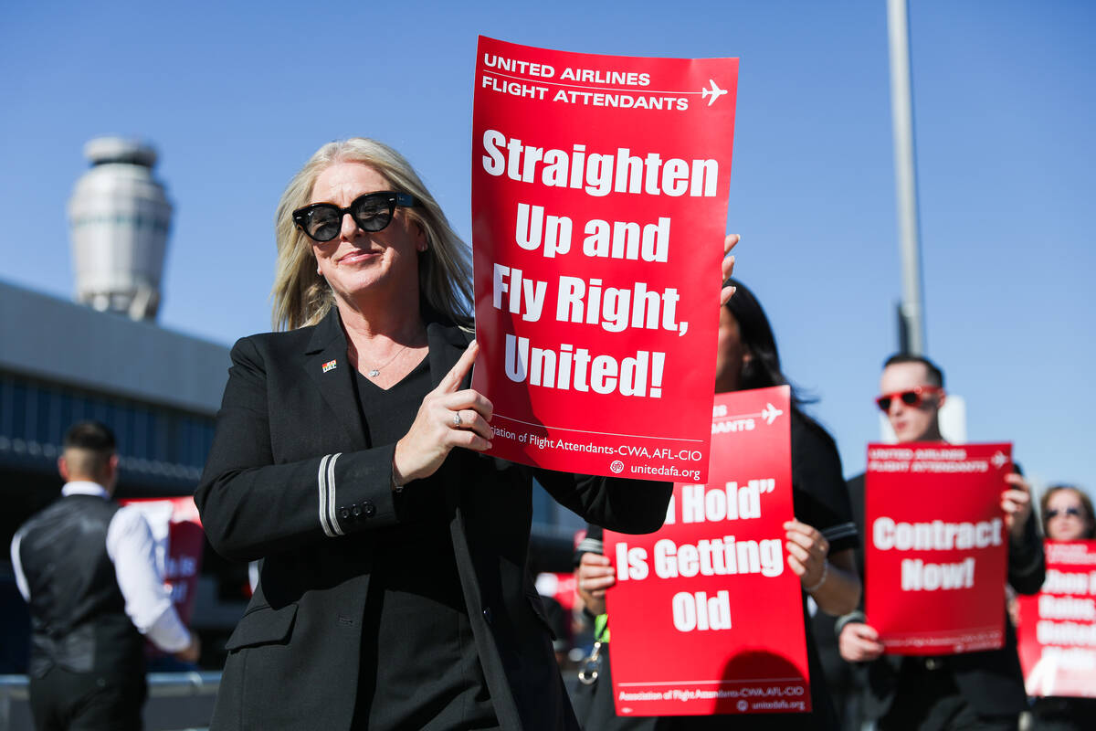 Neena Boswell participates in a picket line march to obtain a new contract and improvements to ...