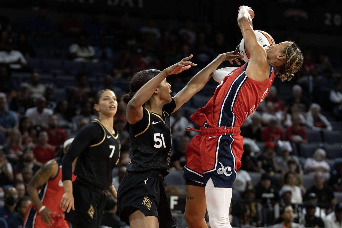Washington Mystics guard Natasha Cloud (9) shoots against Las Vegas Aces guard Sydney Colson (5 ...