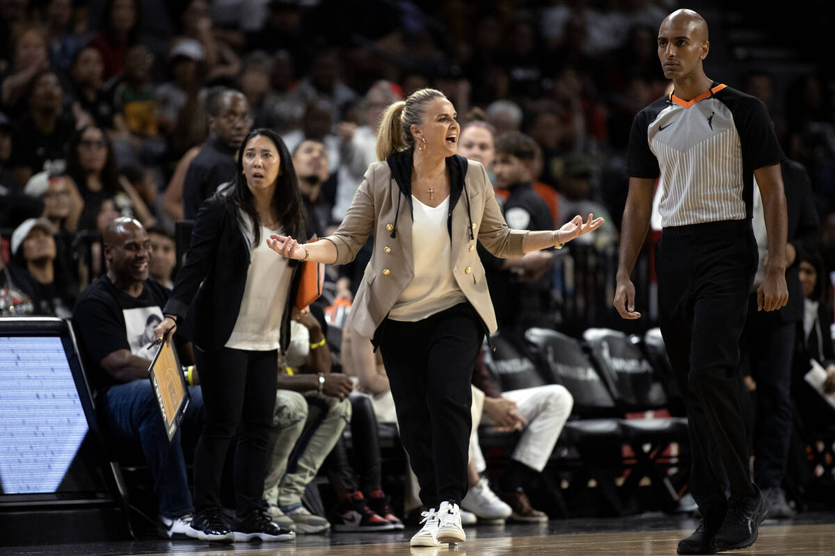 Las Vegas Aces head coach Becky Hammon shouts on the sidelines after guard Kelsey Plum was char ...