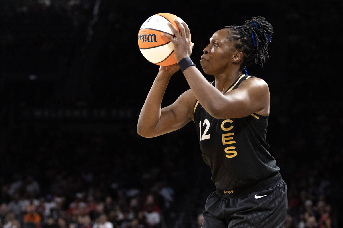 Las Vegas Aces guard Chelsea Gray (12) bends to shoot during the second half of a WNBA basketba ...