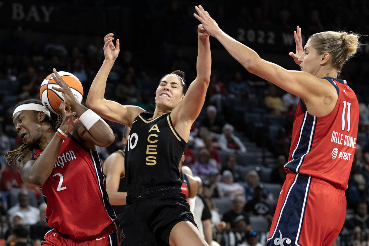 Las Vegas Aces guard Kelsey Plum (10) is fouled by Washington Mystics forward Myisha Hines-Alle ...