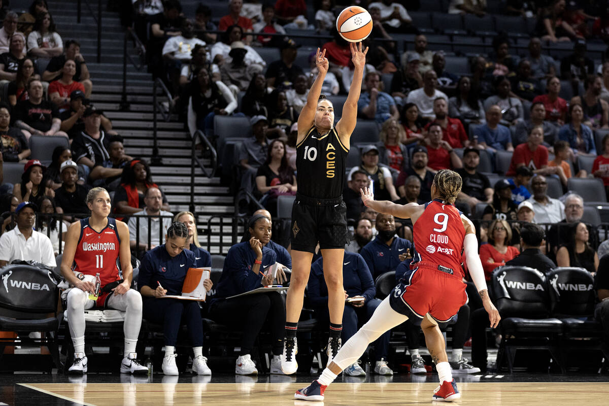 Las Vegas Aces guard Kelsey Plum (10) shoots against Washington Mystics guard Natasha Cloud (9) ...