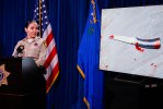 Woman fatally shot by officer stabbed officer, strangled brother, police say