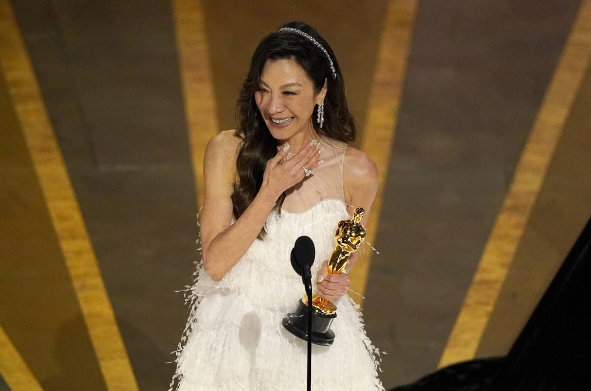 Michelle Yeoh accepts the best actress Oscar for her role in "Everything Everywhere All at ...