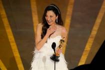 Michelle Yeoh accepts the best actress Oscar for her role in "Everything Everywhere All at ...