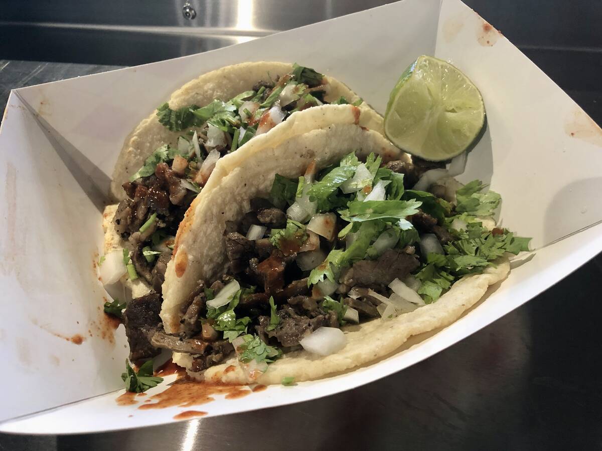 Two carne asada tacos from Abuela's Tacos at Allegiant Stadium, home of the Las Vegas Raiders. ...